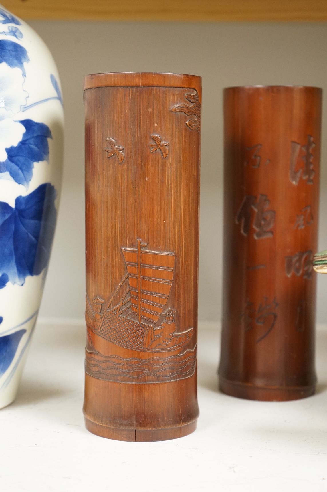 A Chinese Revolution Period porcelain bird group, 21.5cm, a pair of Chinese bamboo brushpots carved with figures and junks, each 22cm high, and a Japanese Seto blue and white vase, 29cm high